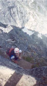 Reid climbs the last few metres to the true summit. 